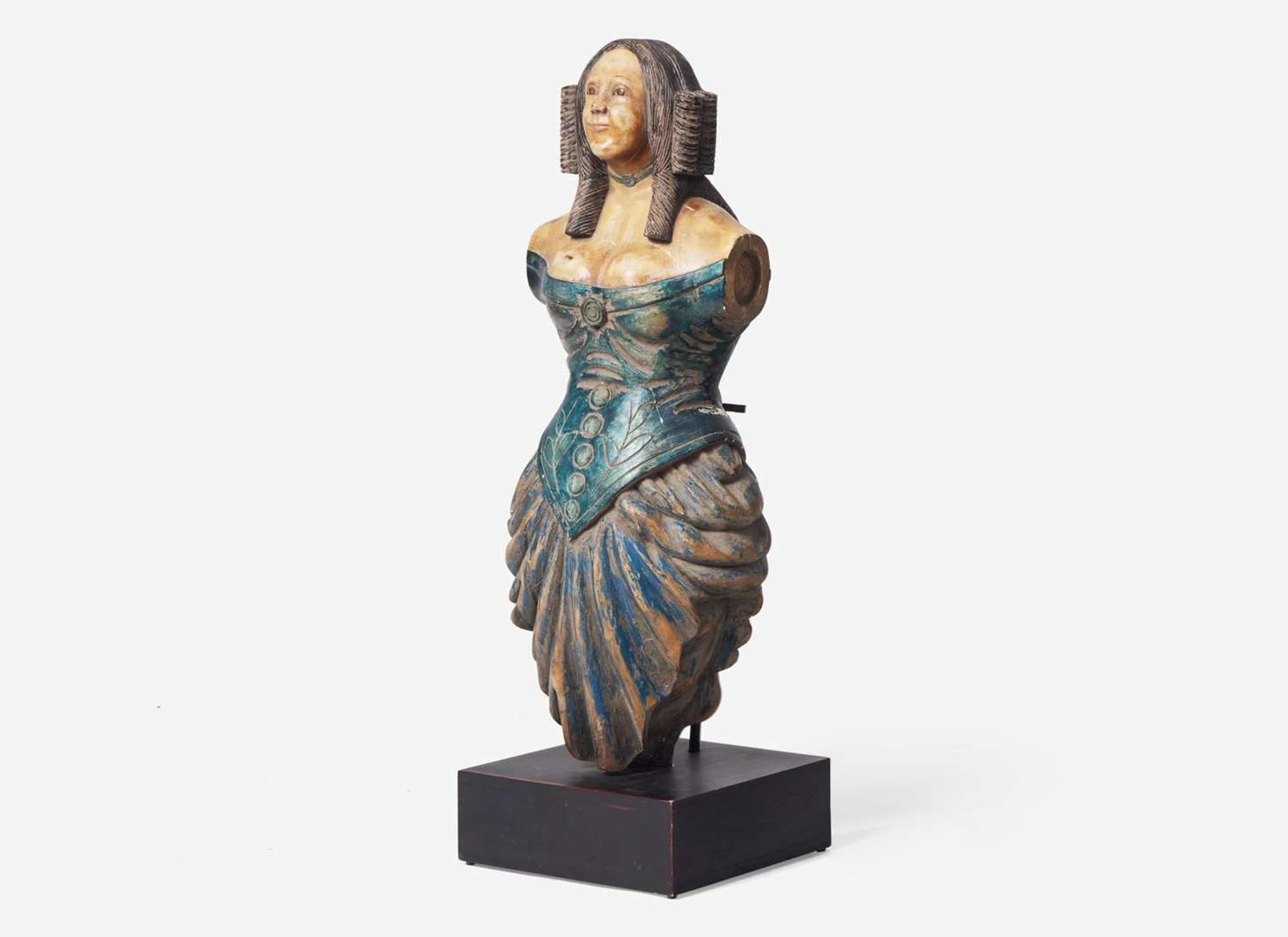 A carved and painted trade figure of a lady, likely 20th century