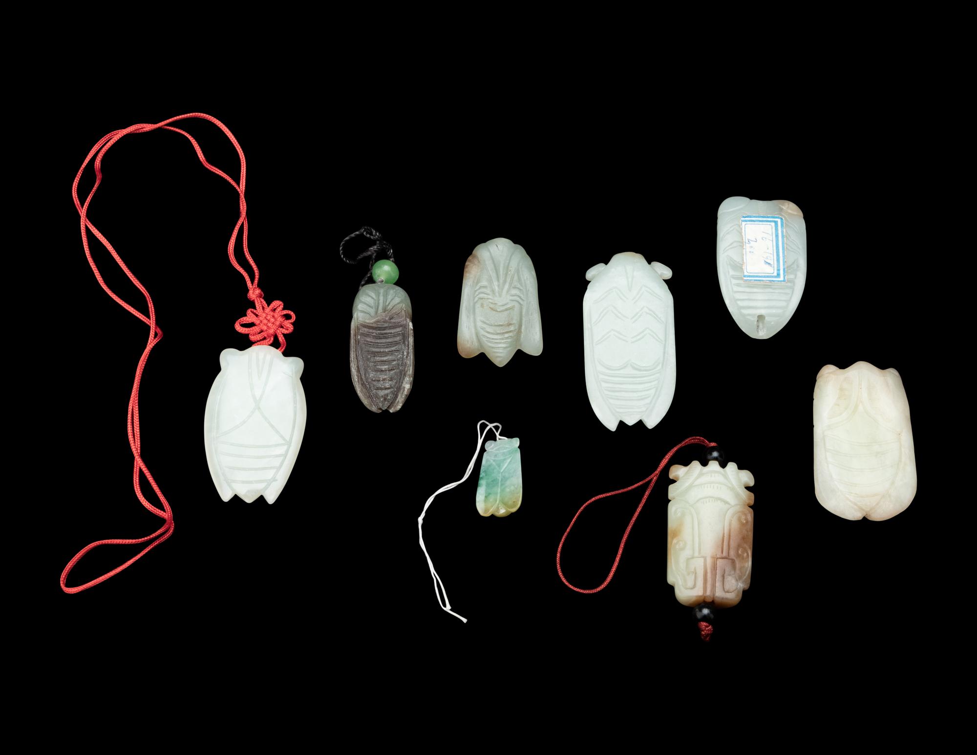 Eight Chinese Jade and Jadeite Cicada-Form Pendants