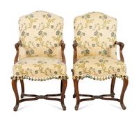 A Pair of Régence Walnut Open Armchairs