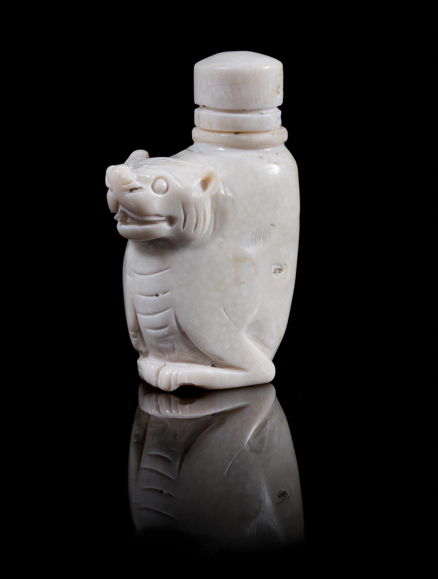 Two Carved Snuff Bottles Height of first 3 inches.