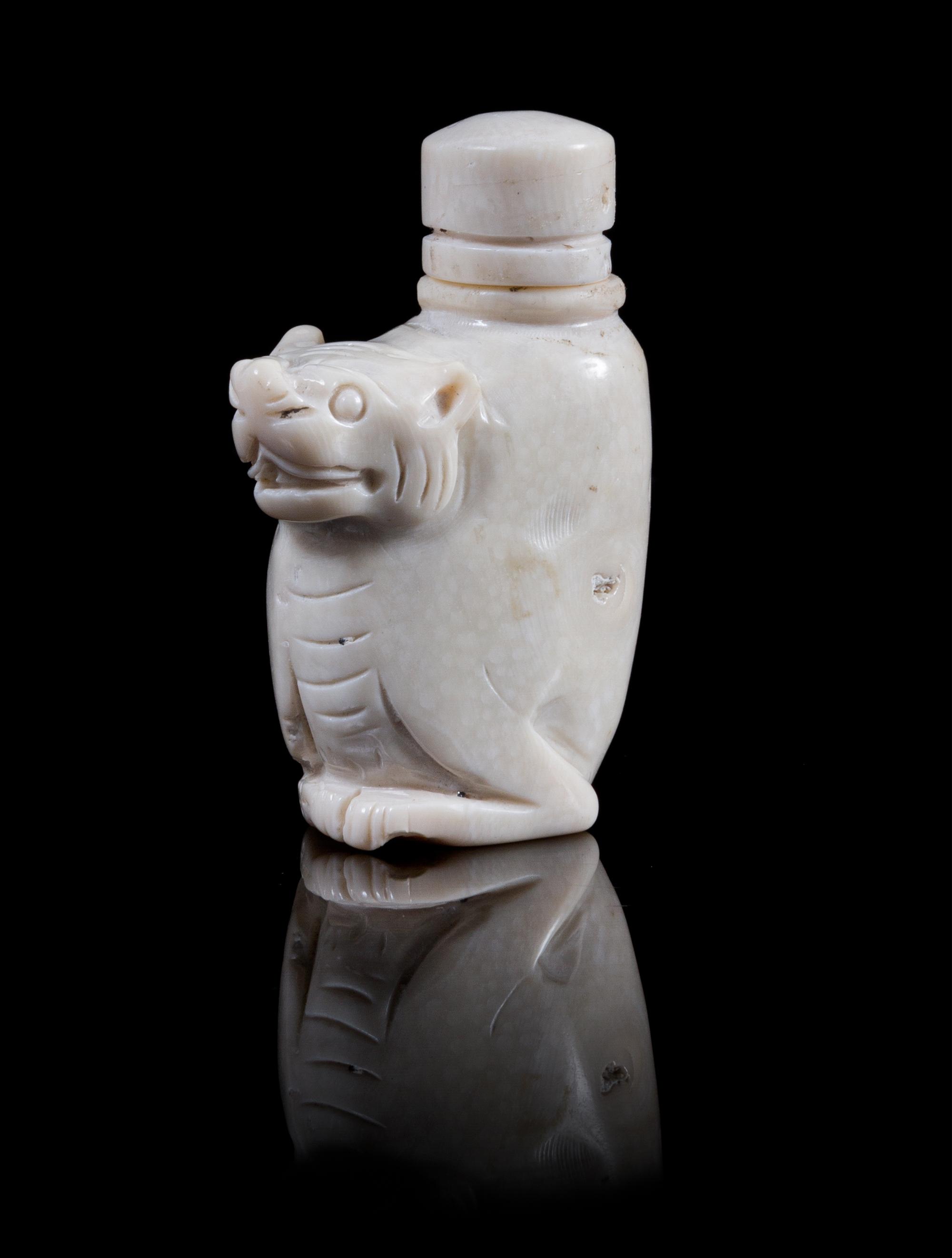 Two Carved Snuff Bottles Height of first 3 inches.
