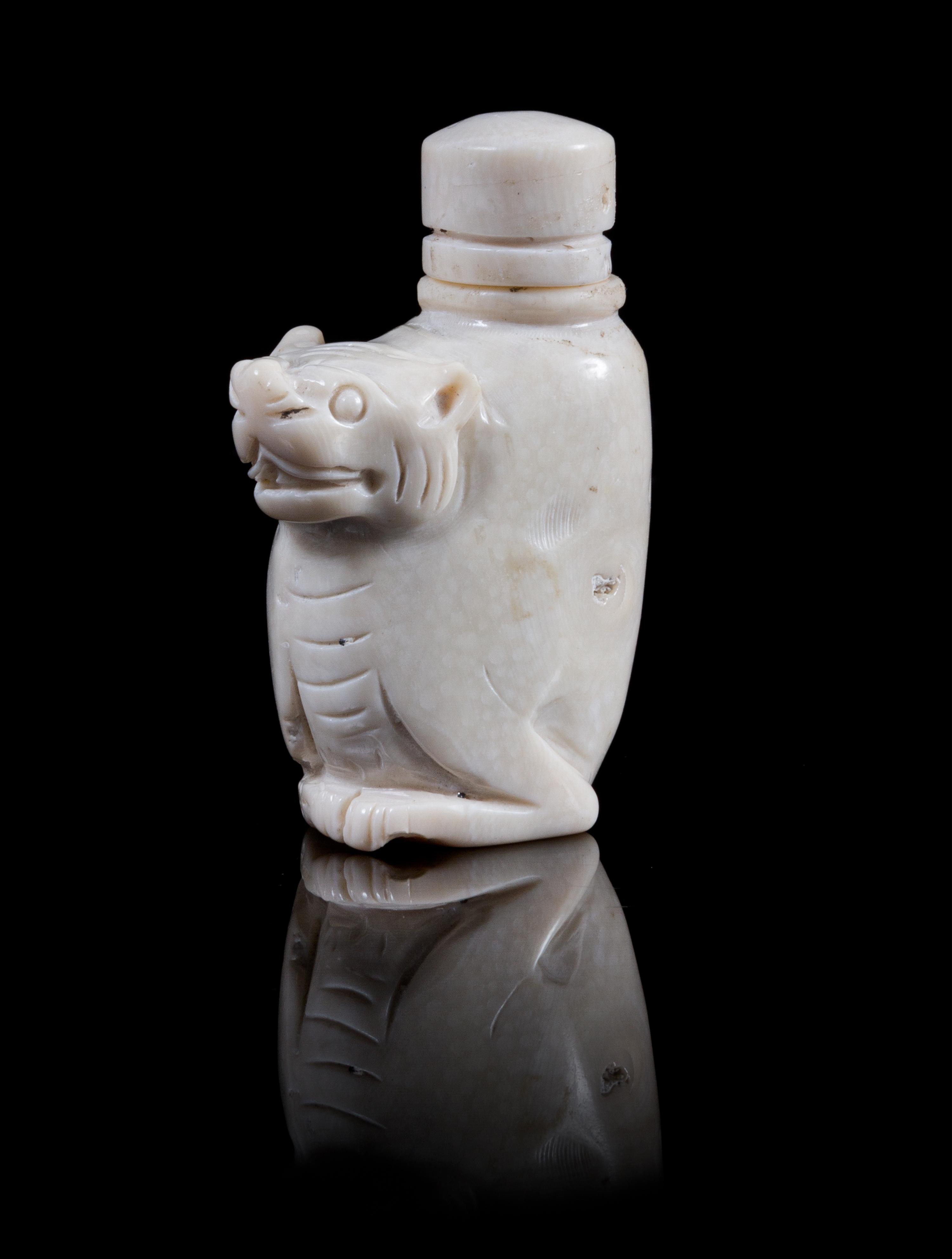 Two Carved Snuff Bottles Height of first 3 inches.