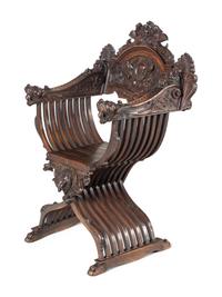 A Renaissance Revival Carved Walnut Savonarola Chair