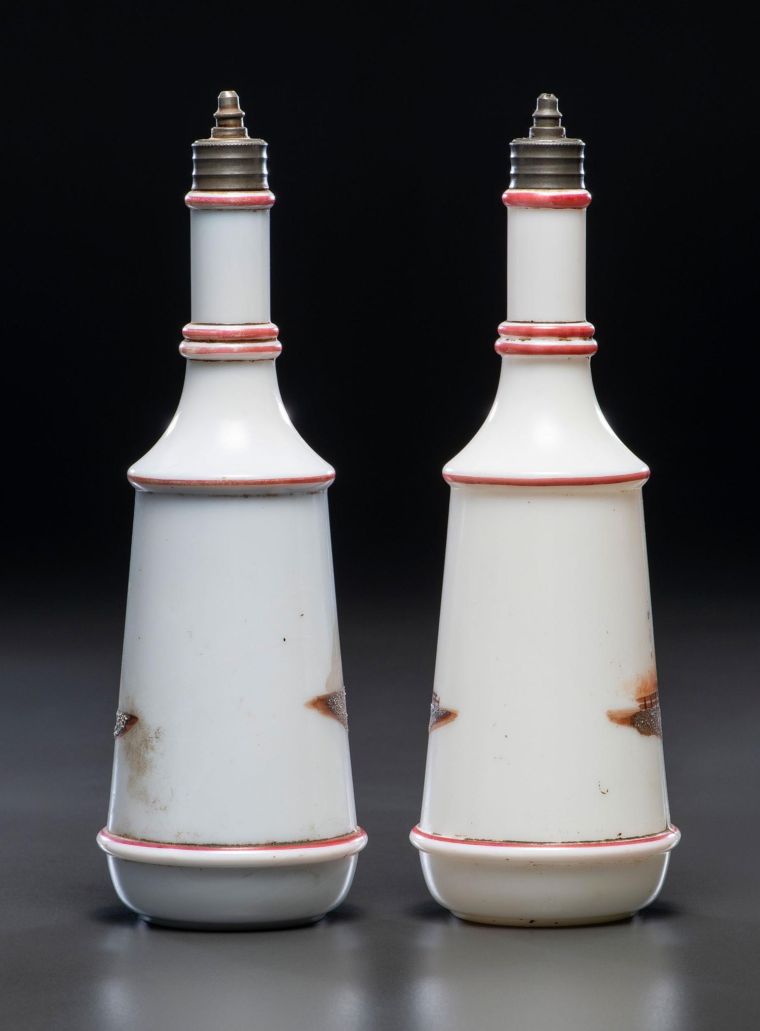 A Pair of Hand Painted Personalized Milk Glass Barber's Bottles