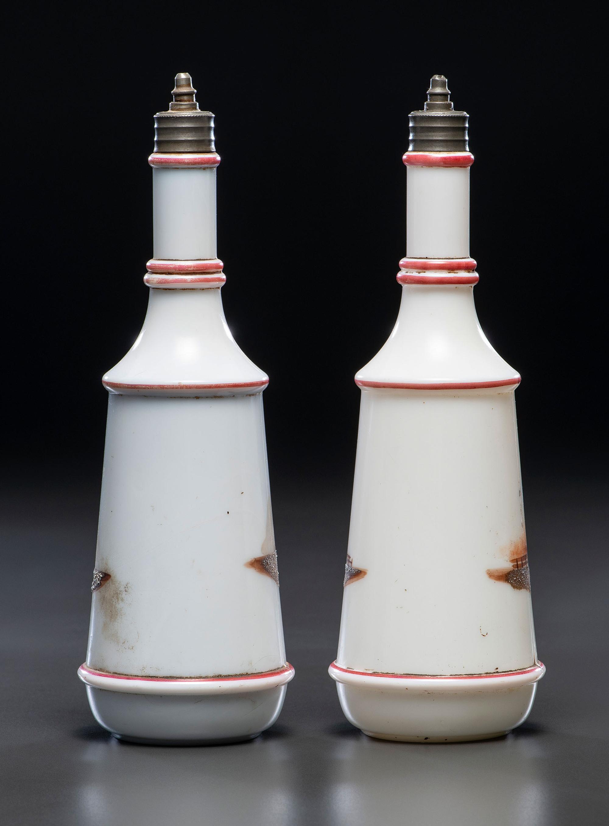 A Pair of Hand Painted Personalized Milk Glass Barber's Bottles