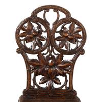 A Pair of Black Forest Oak Leaf Carved Side Chairs