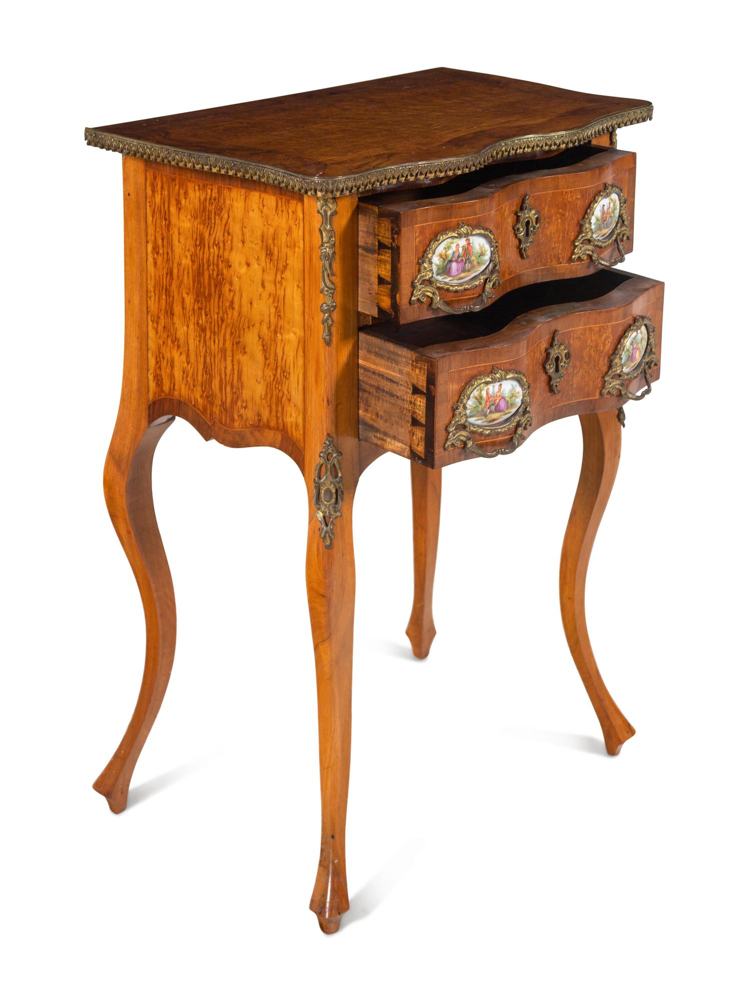 A Louis XV Style Gilt Metal and Porcelain Mounted Side Table