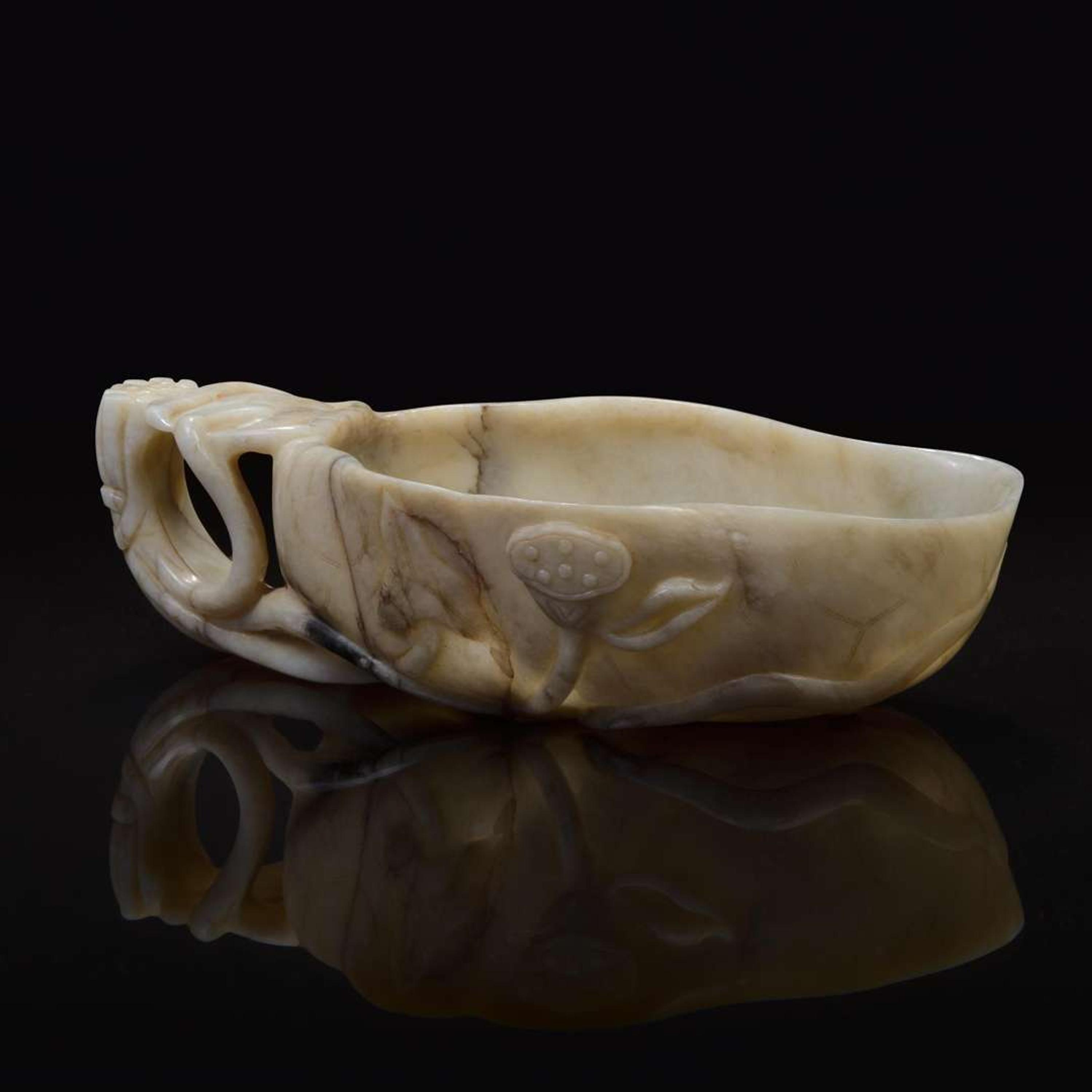 A Chinese creamy-white jade "Lotus Leaf" coupe 白玉荷叶形水盂 Ming/Qing dynasty ???