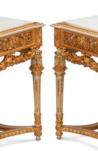 A Pair of Louis XVI Style White Painted and Parcel Gilt Marble-Top Console Tables