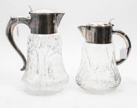 Two Silver-Plate Mounted Cut Glass Pitchers Height of taller 12 3/4 inches.