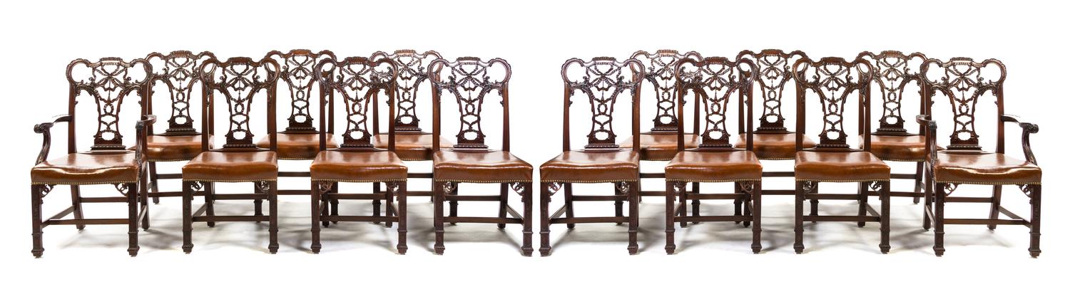 A Set of Fourteen Chippendale Style Mahogany Dining Chairs, Height 40 1/2 inches.
