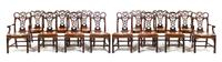 A Set of Fourteen Chippendale Style Mahogany Dining Chairs, Height 40 1/2 inches.