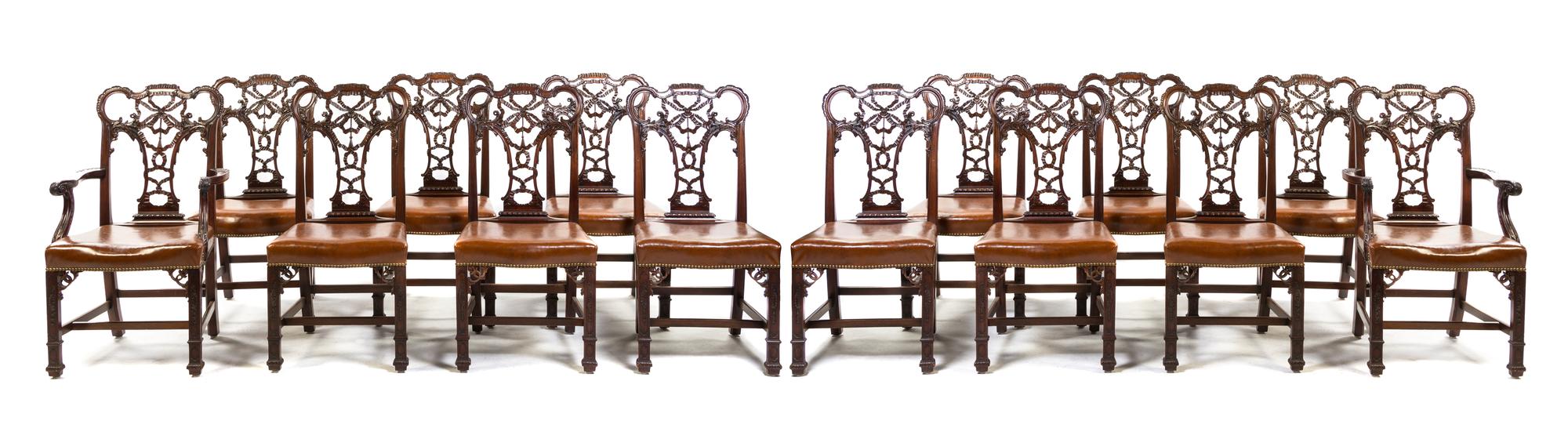 A Set of Fourteen Chippendale Style Mahogany Dining Chairs, Height 40 1/2 inches.
