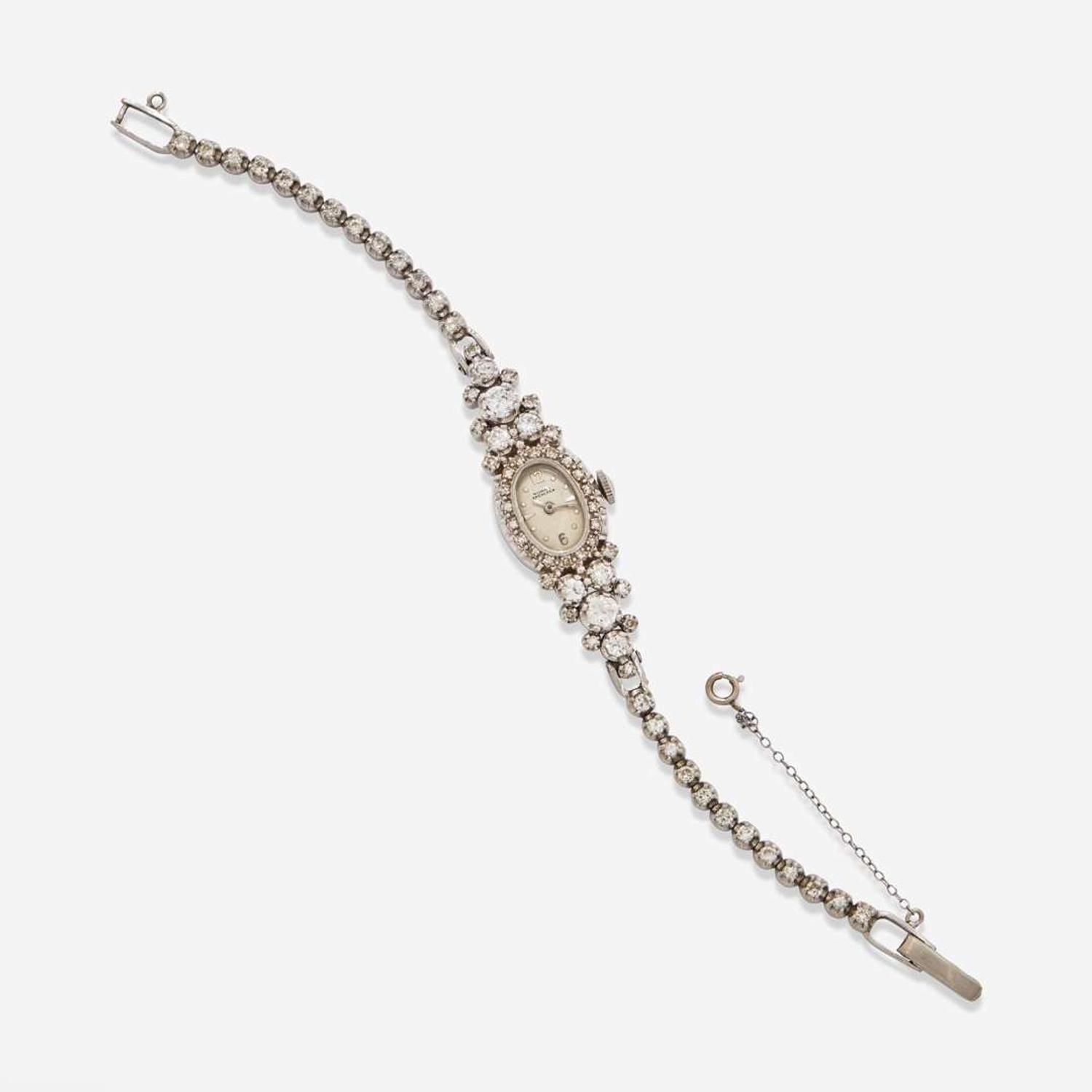 A 14K White Gold and Diamond Bracelet Watch