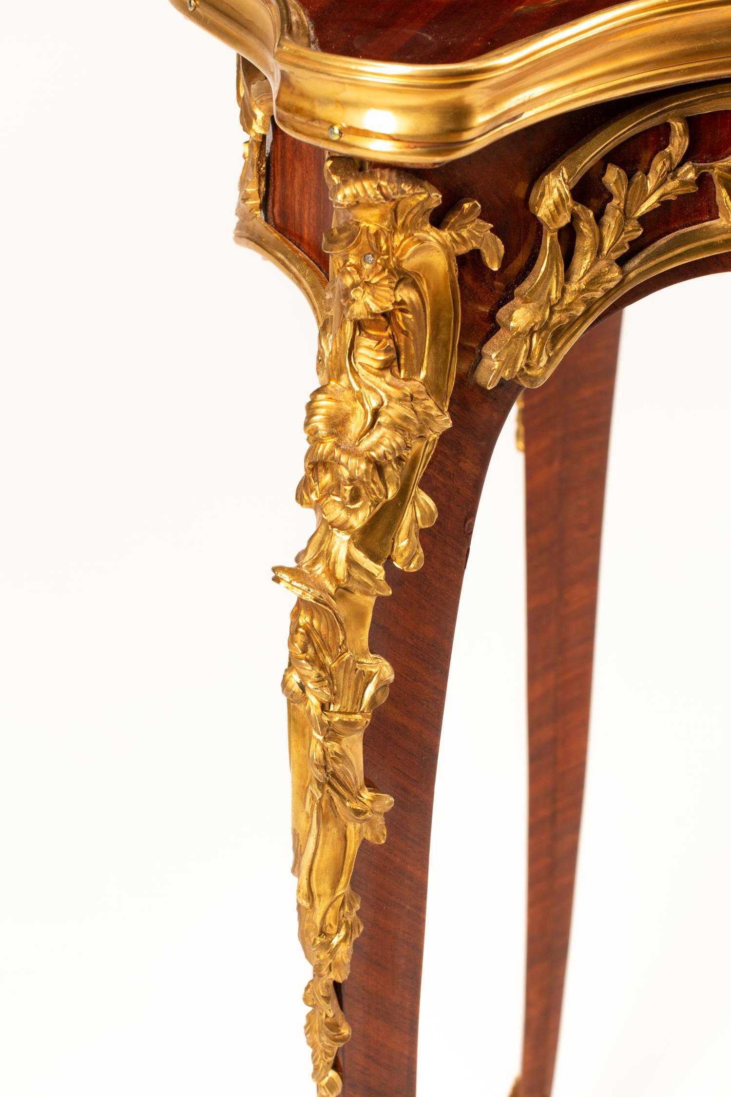 A Louis XV Style Marquetry Cartouche Table
