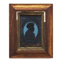 American School 19th Century, A Miniature Eglomise Silhouette Profile Portrait of Benjamin Franklin with Fur Cap