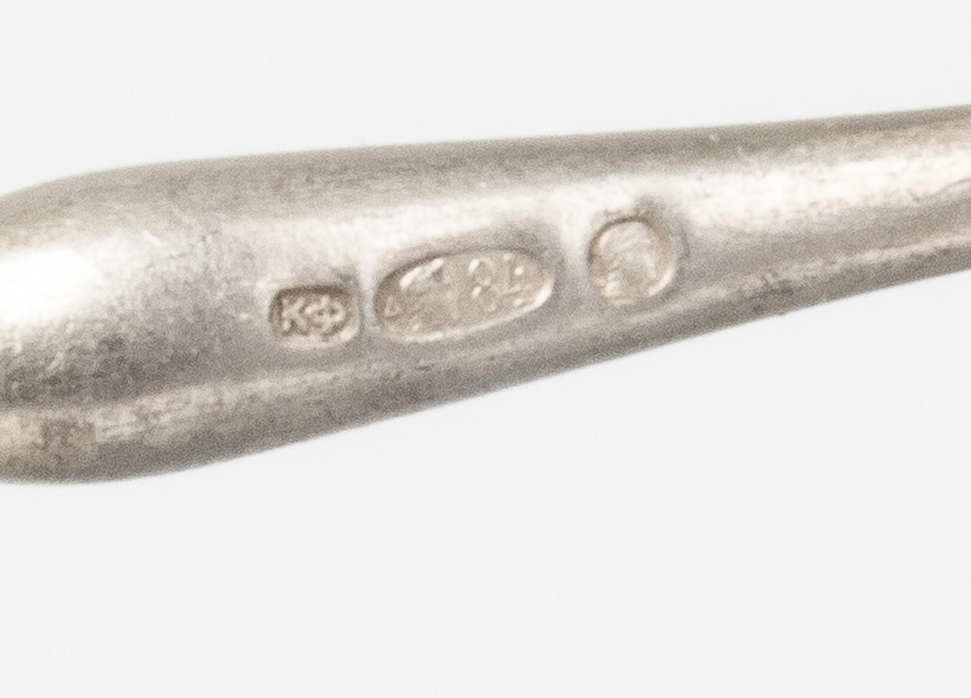 A Group of Russian Silver Flatware, Mark of Karl Faberge, St. Petersburg, the handles with tied garland terminals, comprising: 3 table