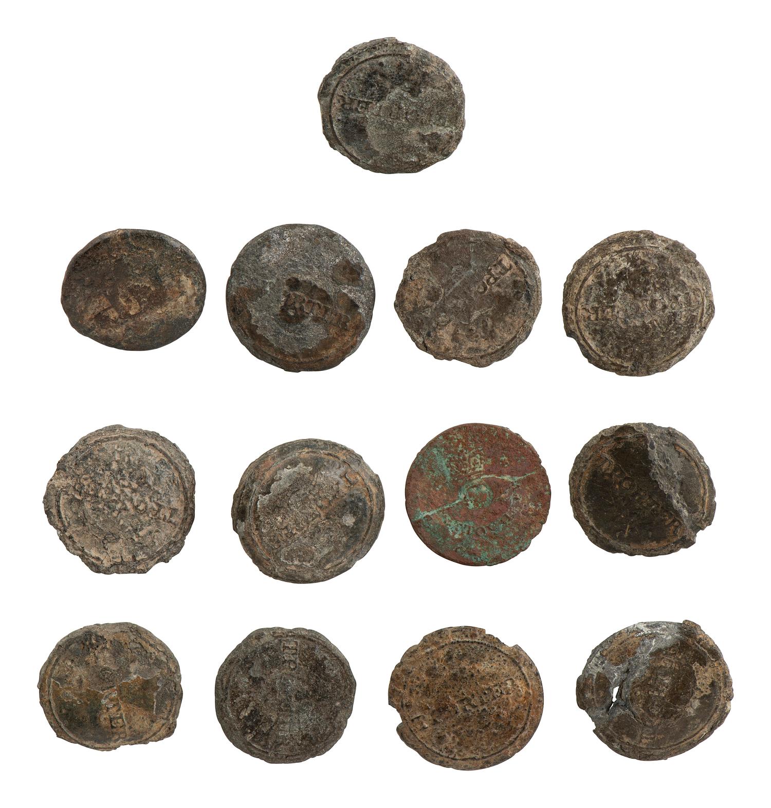[AFRICAN AMERICANA] 13 excavated buttons, some identified to auctioneer and slave trader T. Porter.