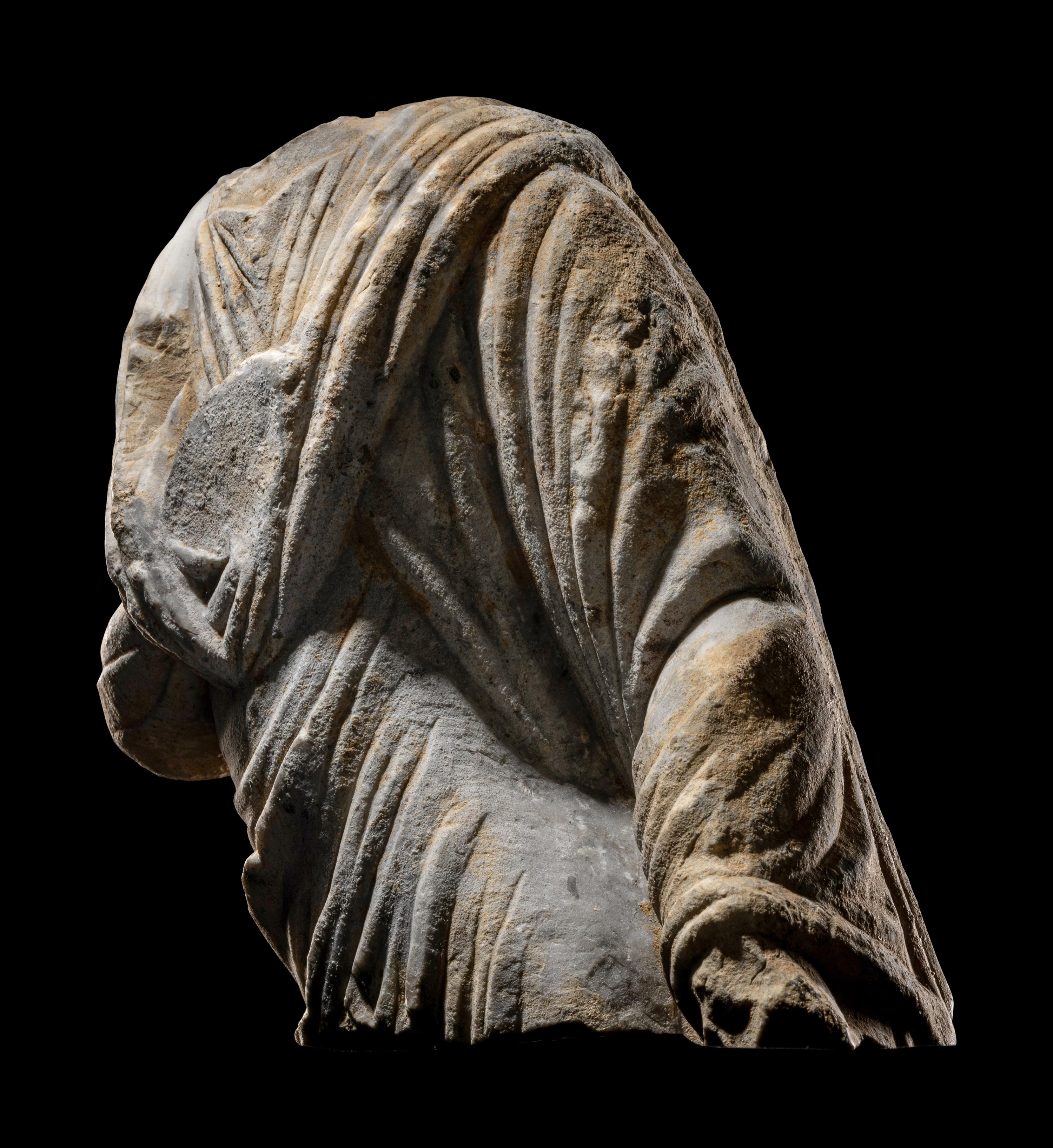 A Roman Marble Draped Torso from a Relief