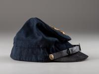 [CIVIL WAR]. McDowell-style forage cap with 4th regimental number and artillery insignia.