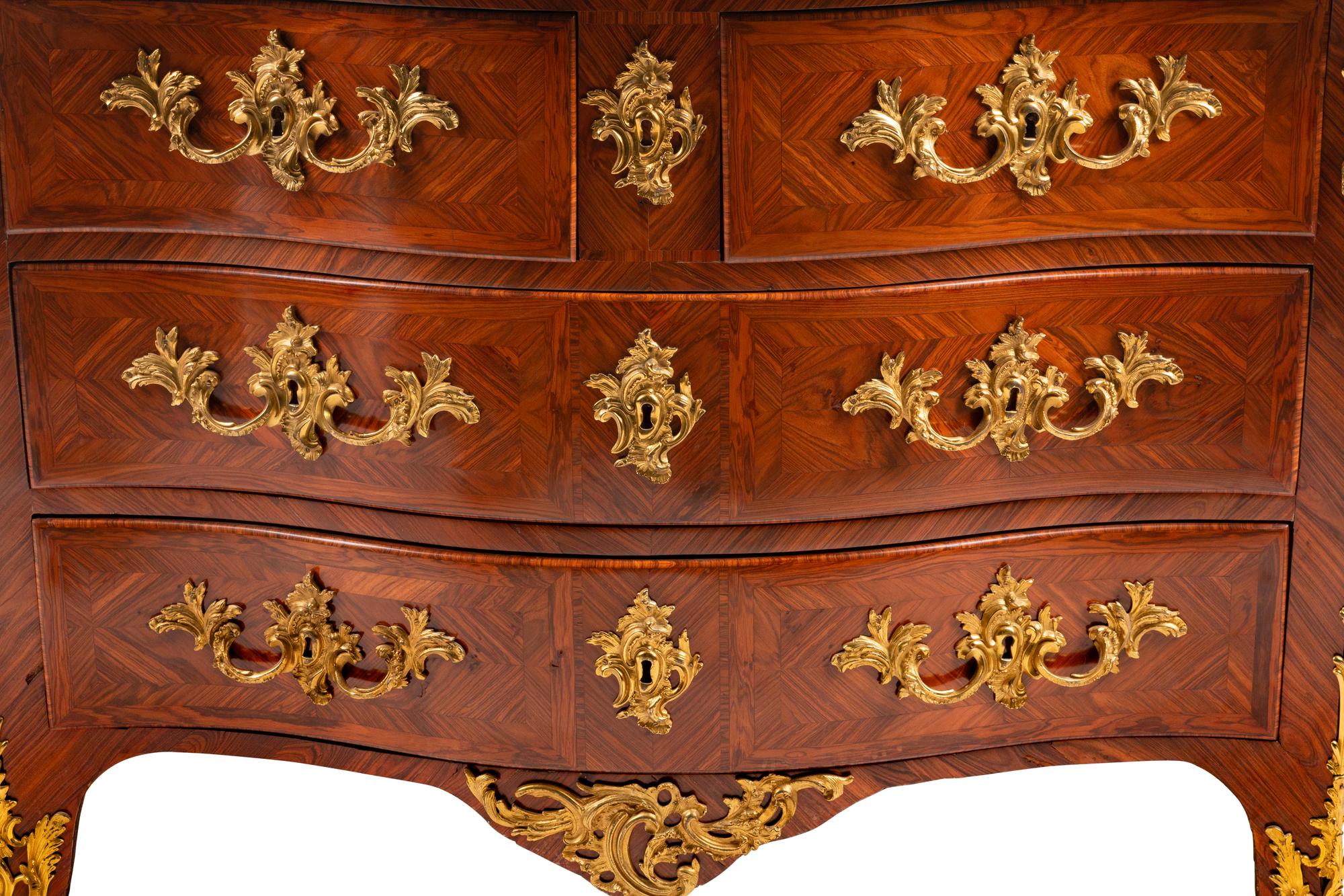 A Régence Gilt Bronze Mounted Tulipwood Marble-Top Commode