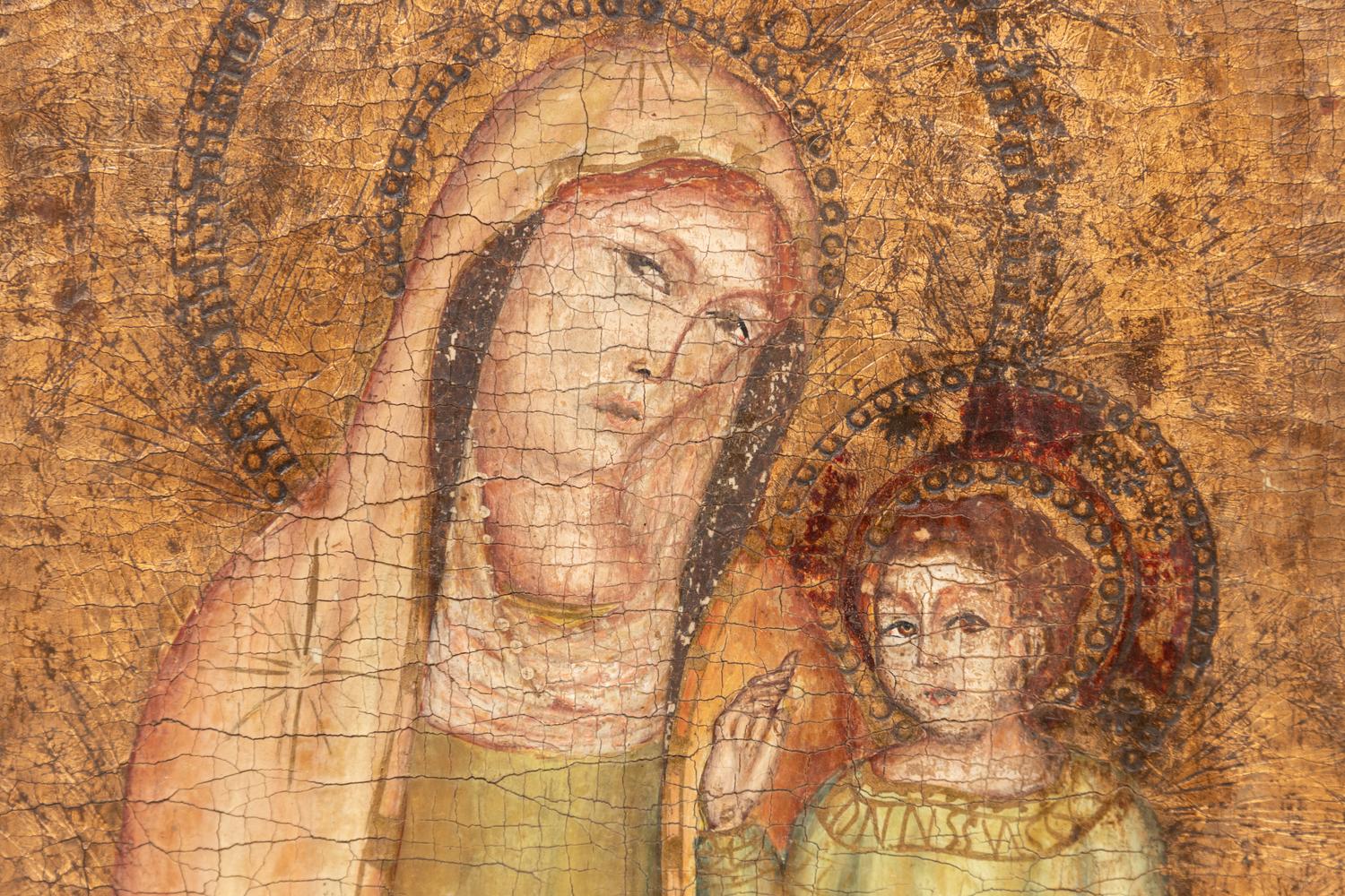 A Continental Painted and Parcel Gilt Triptych