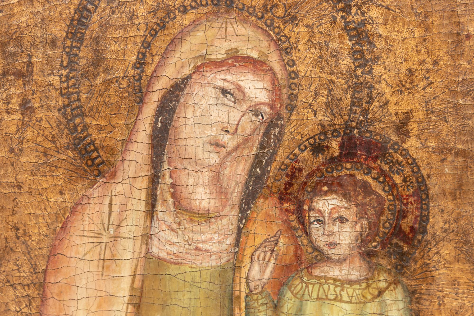 A Continental Painted and Parcel Gilt Triptych