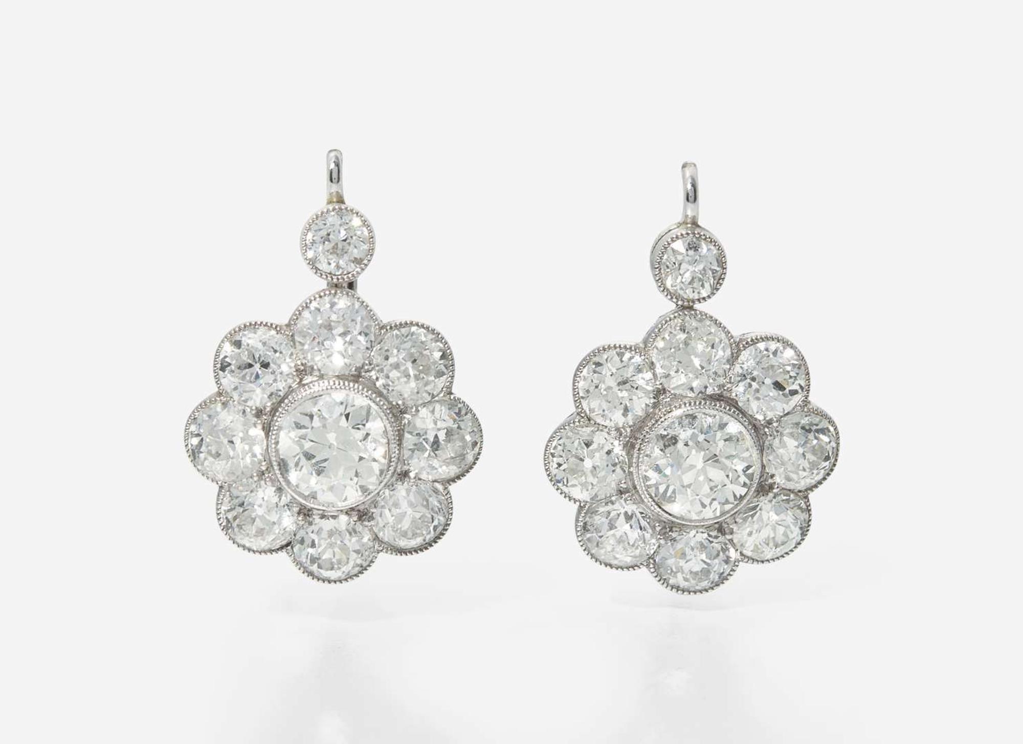 A Pair of 14K White Gold and Diamond Earrings