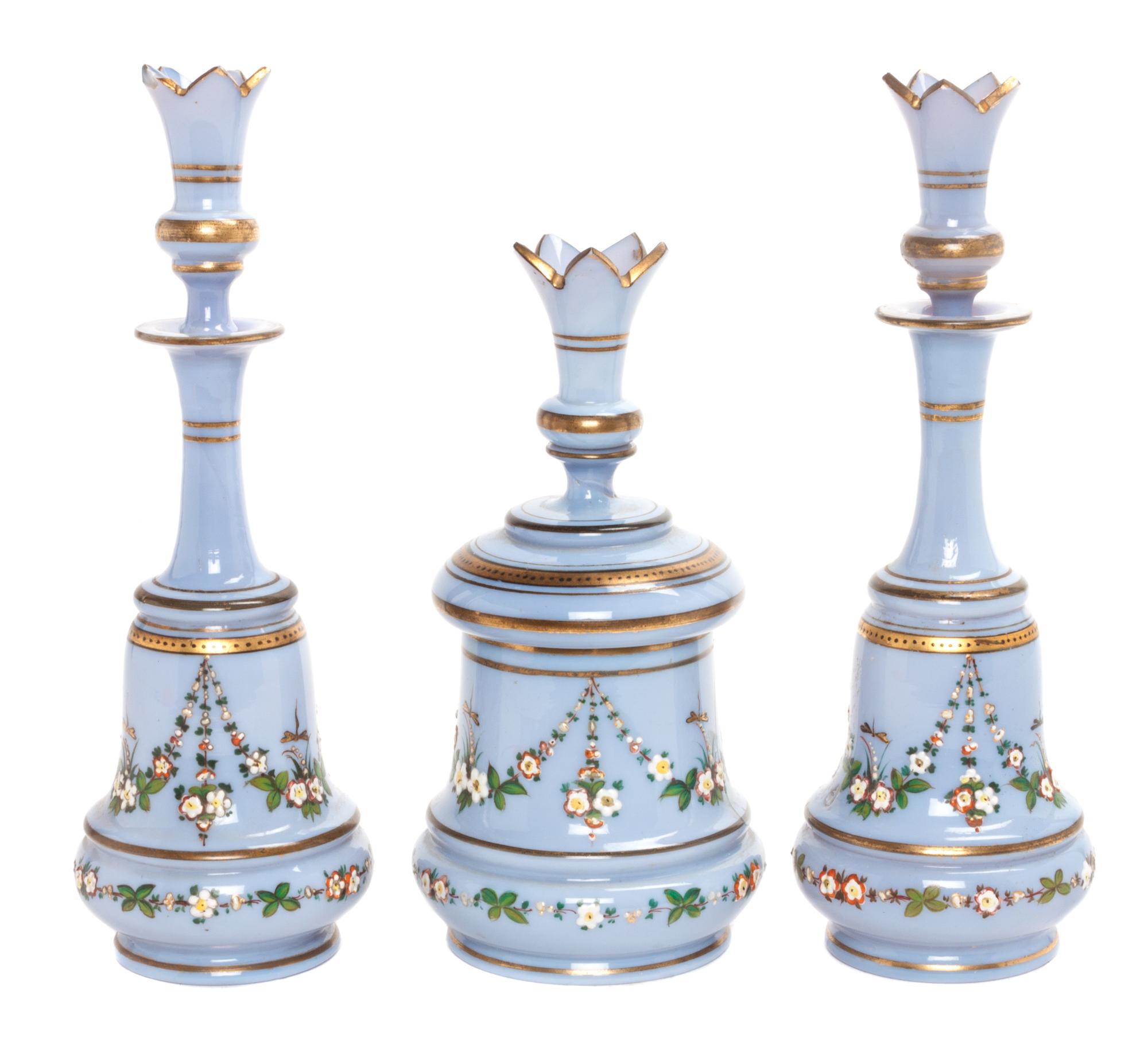 An Enameled Glass Three-Piece Dresser Set Height of bottles 9 1/2 inches.