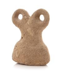 A Syrian Basalt Spectacle Idol Height 5 5/8 x width 4 1/8 inches. — CIRCA 4TH MILLENNIUM B.C.E.