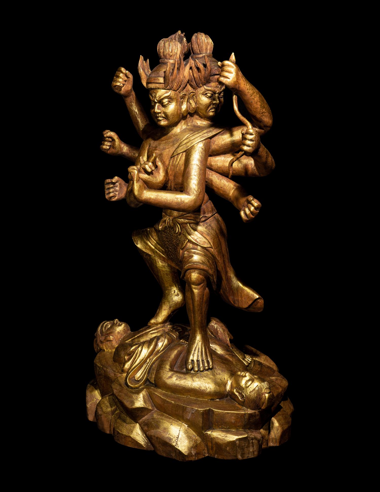A Chinese Gilt Lacquered Wood Figure of a Deity