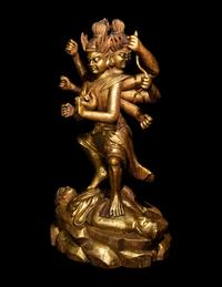 A Chinese Gilt Lacquered Wood Figure of a Deity