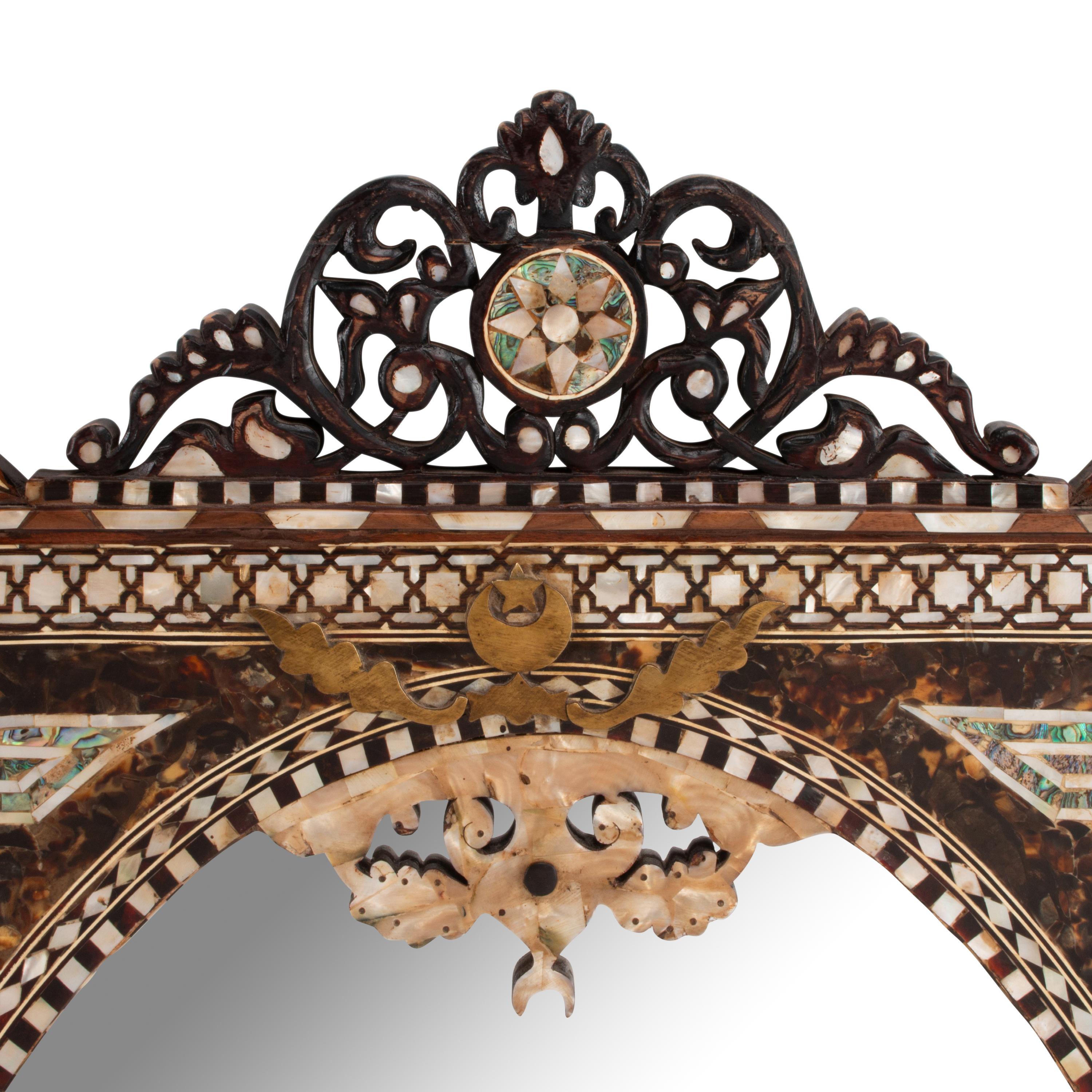 A Pair of Iberian Marquetry Oval Mirrors