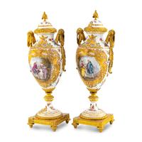 A Pair of Sèvres Style Porcelain and Gilt Bronze Mounted Urns