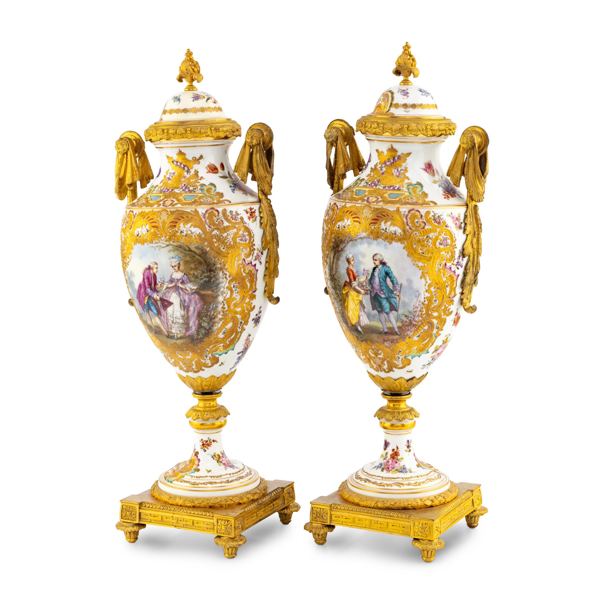 A Pair of Sèvres Style Porcelain and Gilt Bronze Mounted Urns