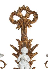 A Pair of Continental Gilt Bronze and Bisque Porcelain Two-Light Sconces