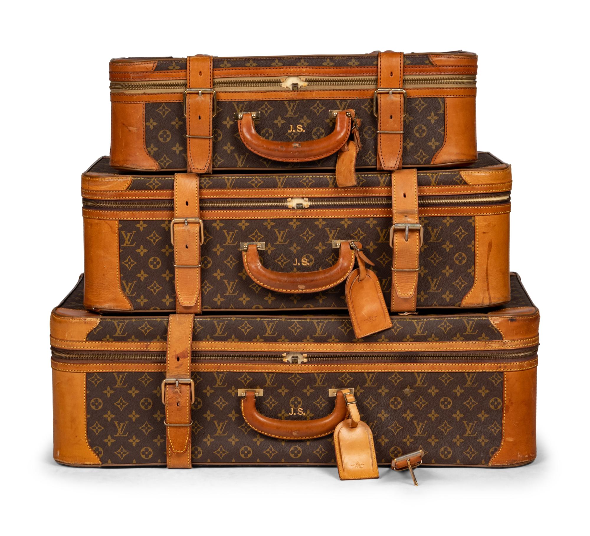 A Group of Three Louis Vuitton Soft-Sided Suitcases, 20th Century