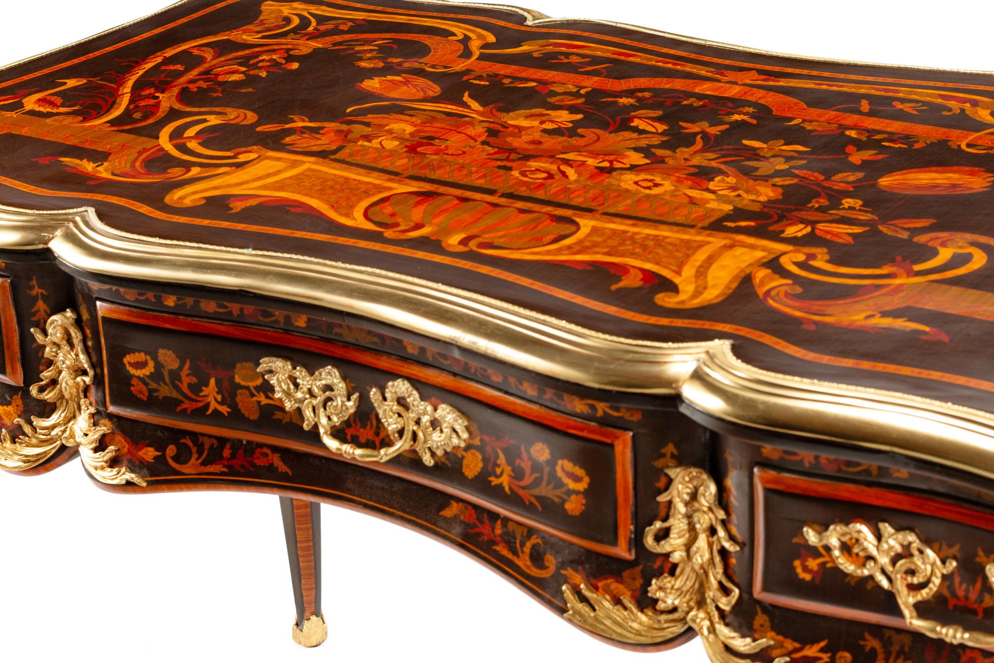 A Louis XV Style Gilt Bronze Mounted Marquetry Bureau Plat
