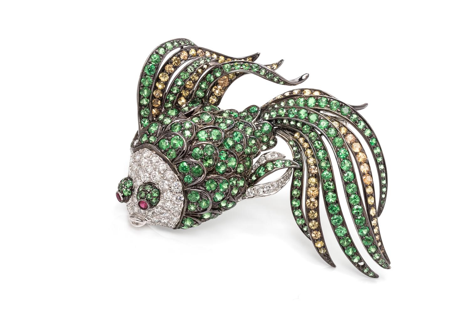 An 18 Karat White, Blackened Gold, Multigem and Diamond Fish Brooch,