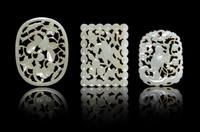 Three Pale Celadon Jade Plaques Length of largest 2 5/8 inches. — QING DYNASTY (1644-1911)