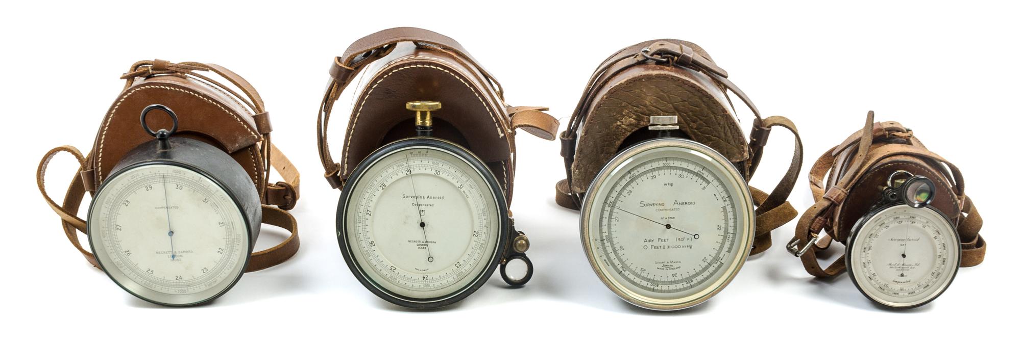 A Group of Four Surveying Aneroids Diameter of largest 4 3/4 inches. — VARIOUS MAKERS, LONDON, 20TH CENTURY