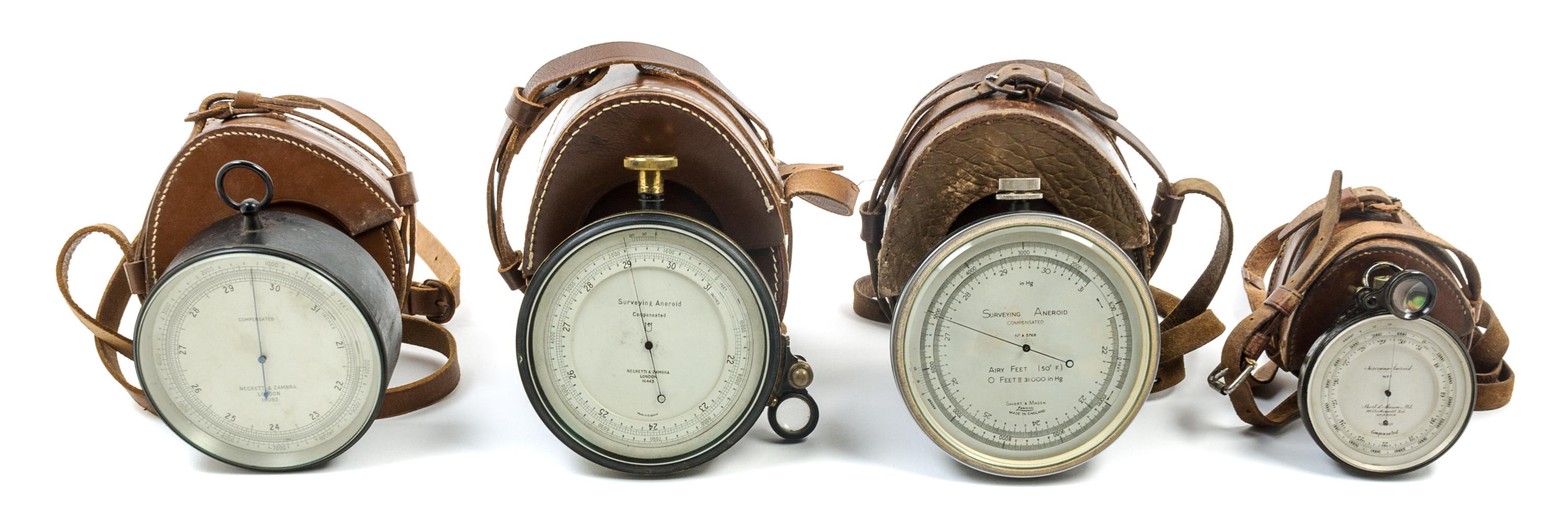 A Group of Four Surveying Aneroids Diameter of largest 4 3/4 inches. — VARIOUS MAKERS, LONDON, 20TH CENTURY