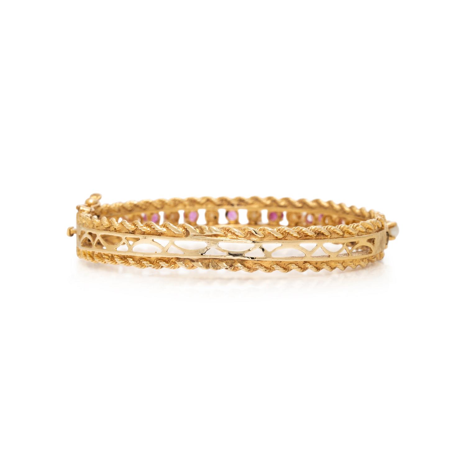 PINK SAPPHIRE, SEED PEARL, AND YELLOW GOLD BANGLE BRACELET