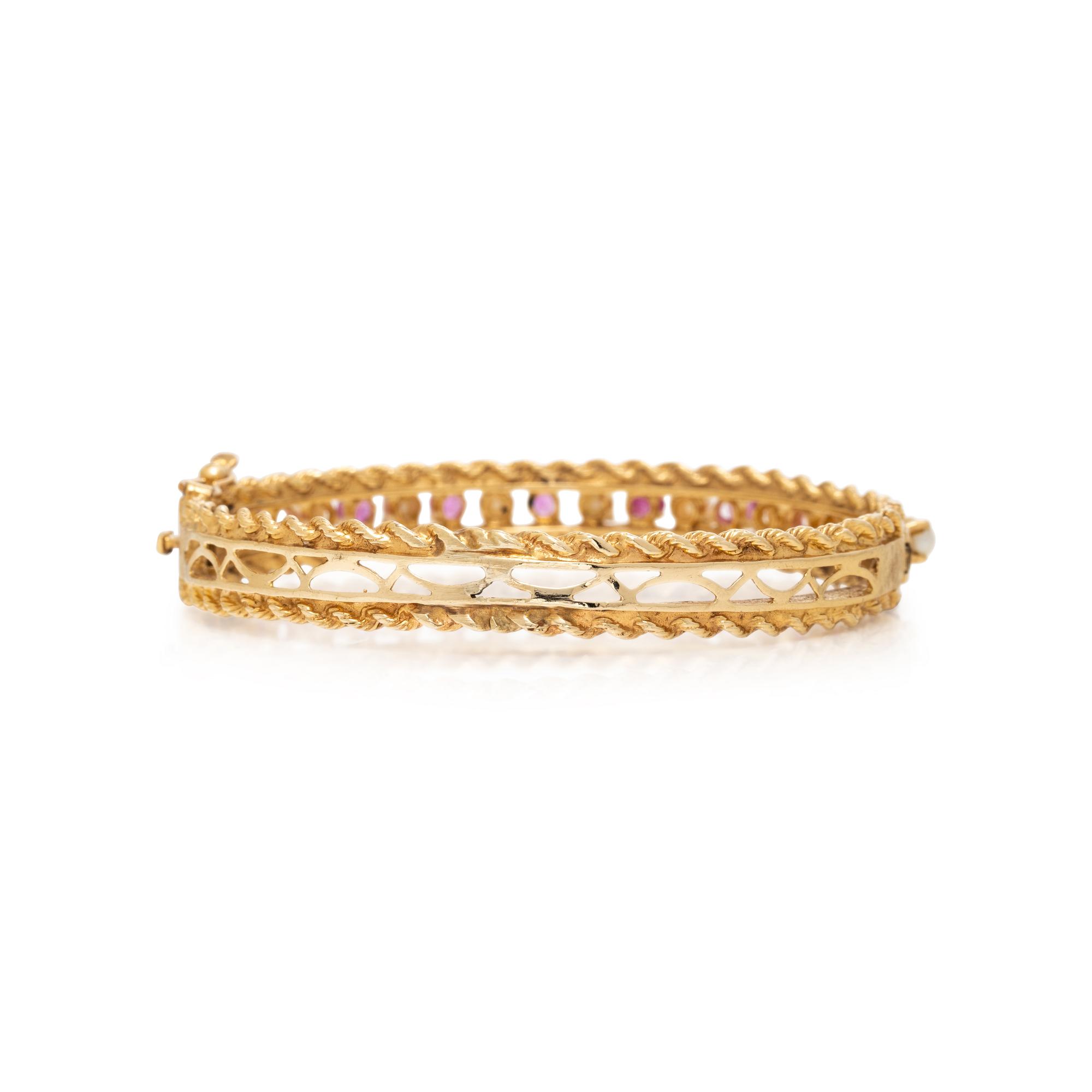 PINK SAPPHIRE, SEED PEARL, AND YELLOW GOLD BANGLE BRACELET
