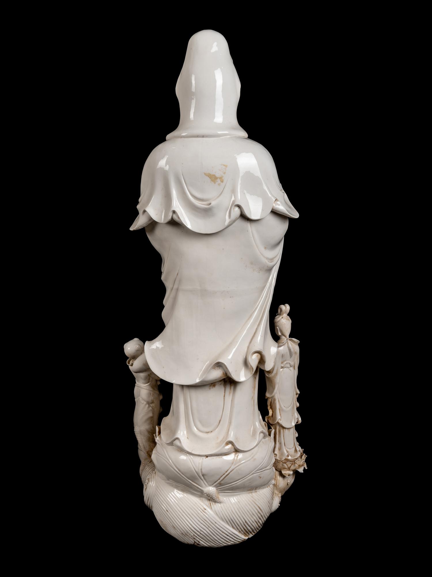 A Monumental Chinese Blanc-de-Chine Porcelain Guanyin Figural Group