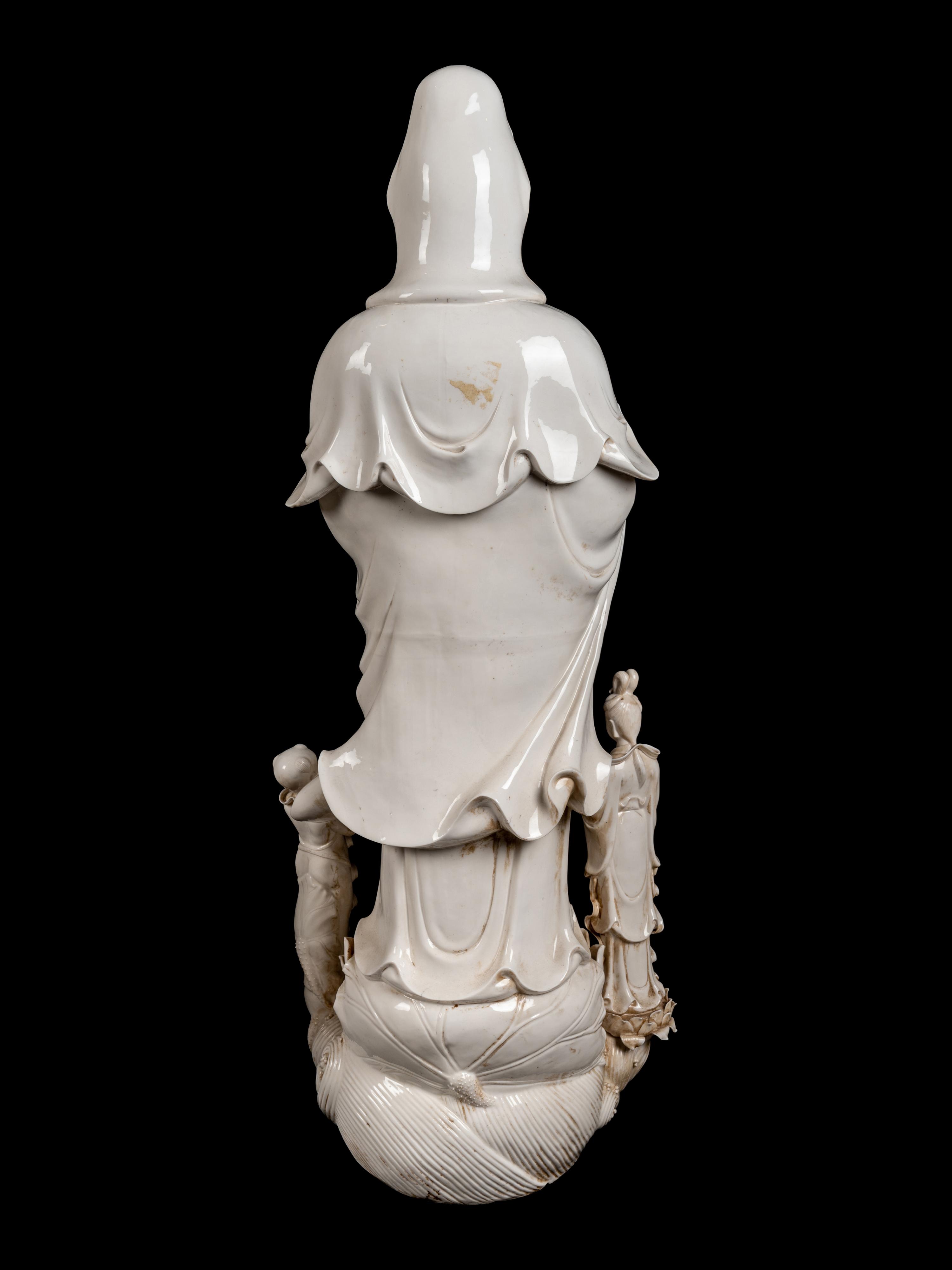 A Monumental Chinese Blanc-de-Chine Porcelain Guanyin Figural Group