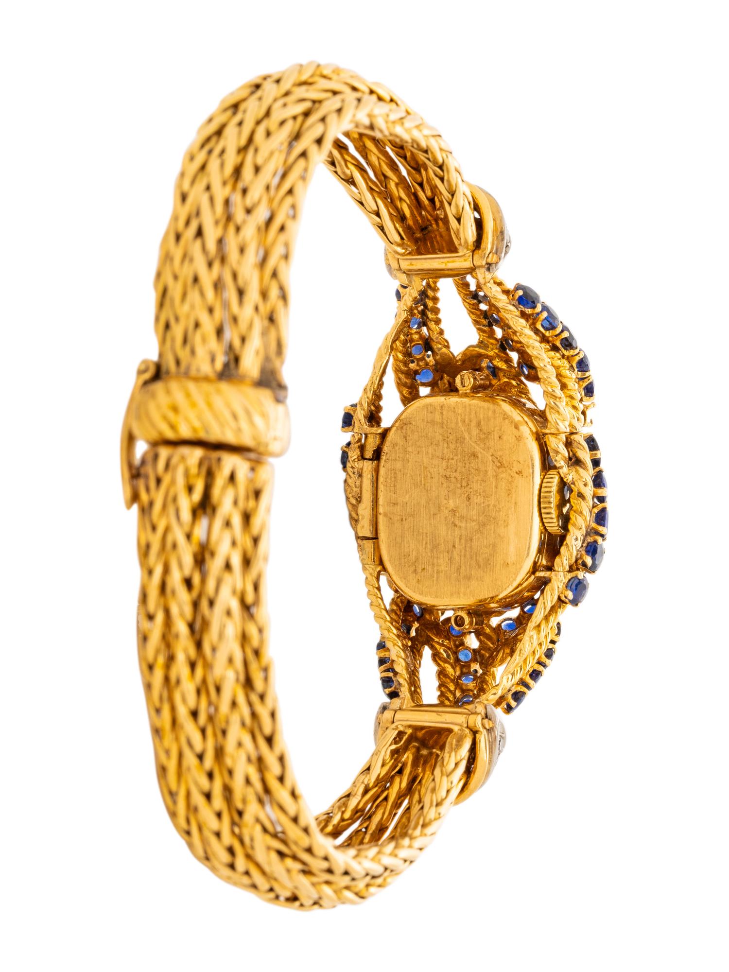 GÜBELIN, YELLOW GOLD, SAPPHIRE AND DIAMOND SURPRISE WATCH