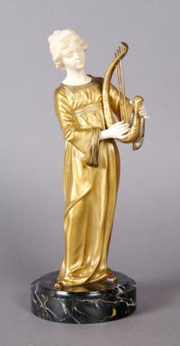 A French Ivory and Bronze Figure, Gori, Height overall 11 1/2 inches.