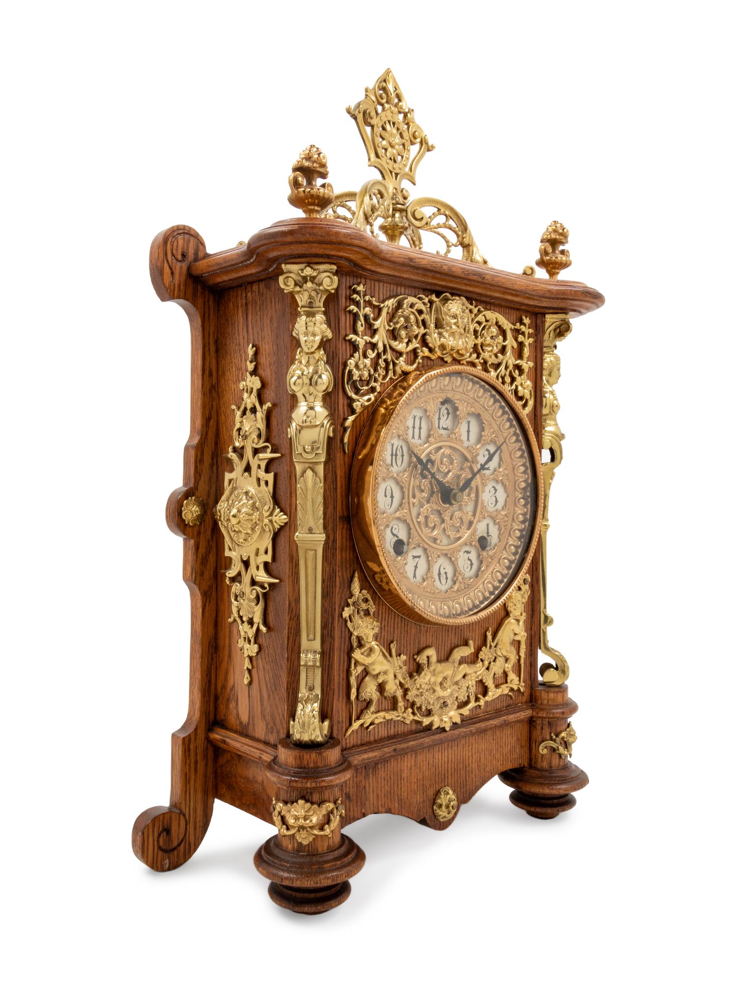 An Ansonia Cabinet B Gilt Metal Mounted Oak Shelf Clock