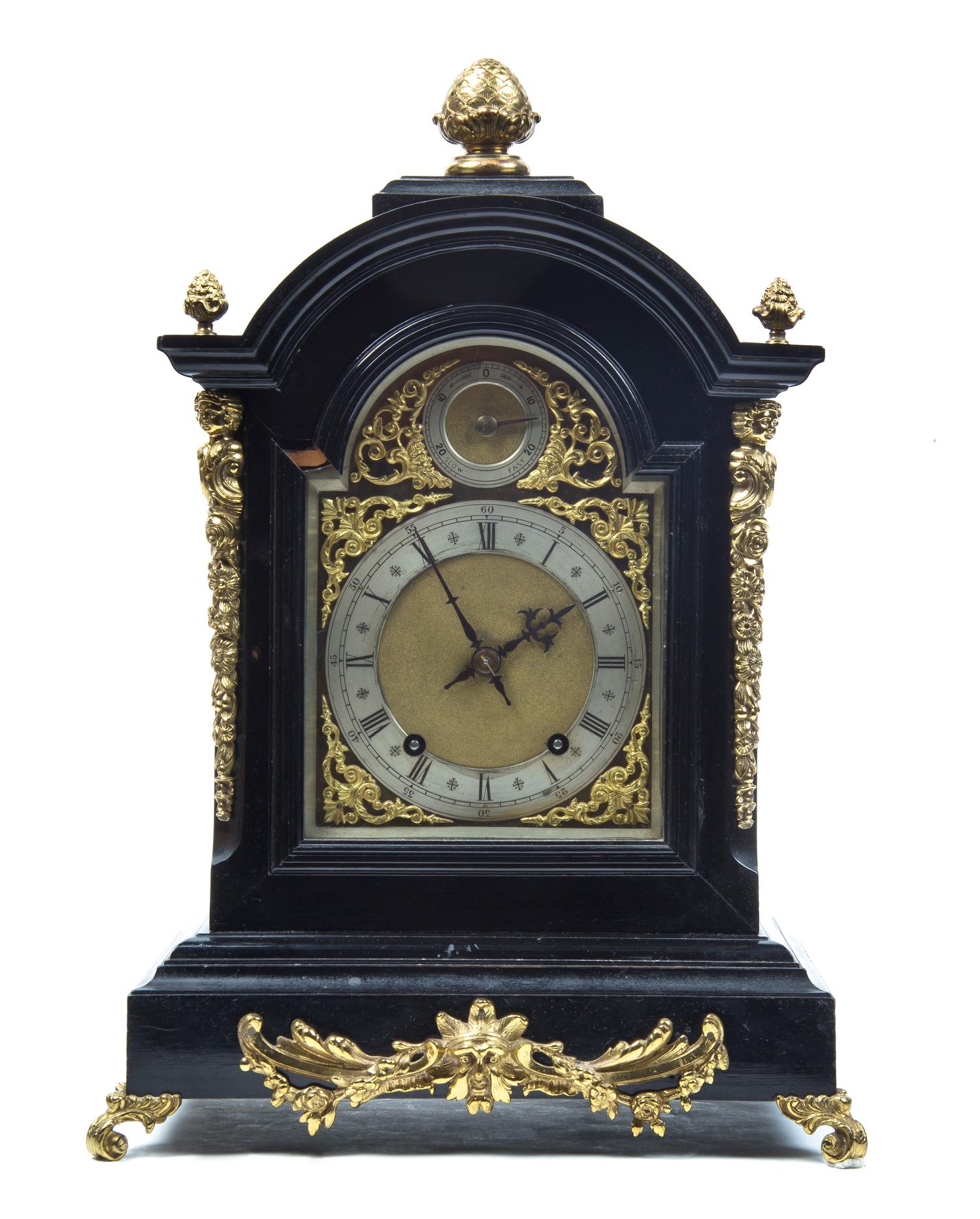 An English Ebonized and Gilt Metal Mounted Bracket Clock, Height of clock 21 inches.